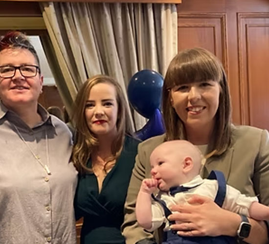 LGBT+ couple with their baby and celebrant at a Humanist Naming Ceremony