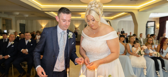 Couple light the Unity Candle during their Humanist Wedding Ceremony.