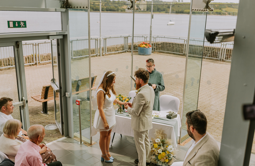 Sarah Donovan Humanist Celebrant with a couple exchanging rings at their legal wedding in Dungarvan